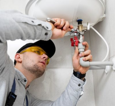 worker-repairing-water-heater_23-2149334230